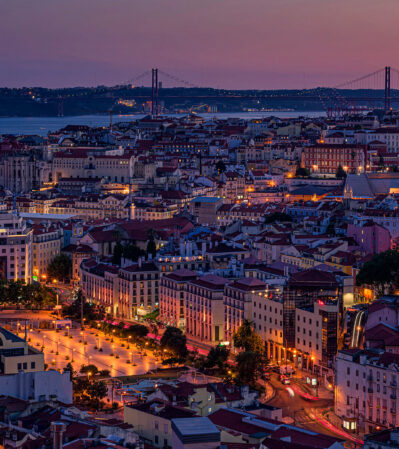 The unique architecture and urban layout of Lisbon are best viewed from above The aerial view would reveal a mix of historic buildings with their distinctive tiled facades, and colorful rooftops.